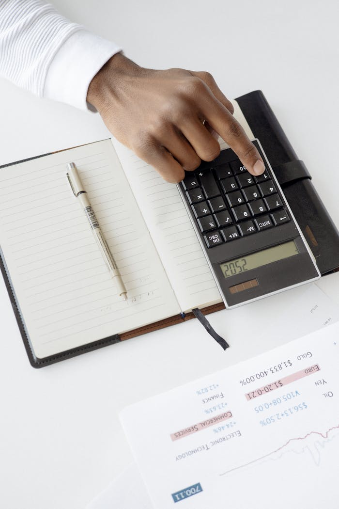 Person using Black Calculator